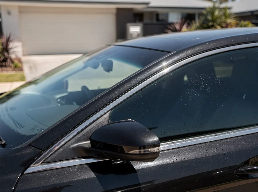 Flawless dark ceramic window tint with clean-cut edge on a car in Perth.