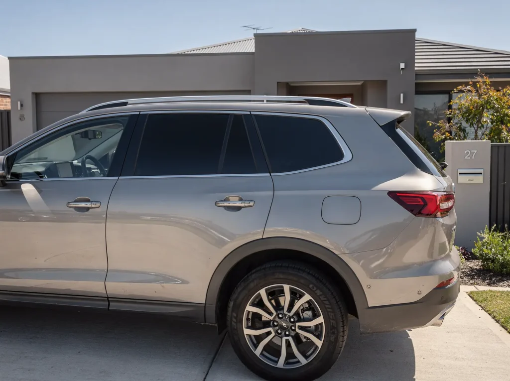 Three-quarter rear view of an SUV with fully tinted windows in Perth.