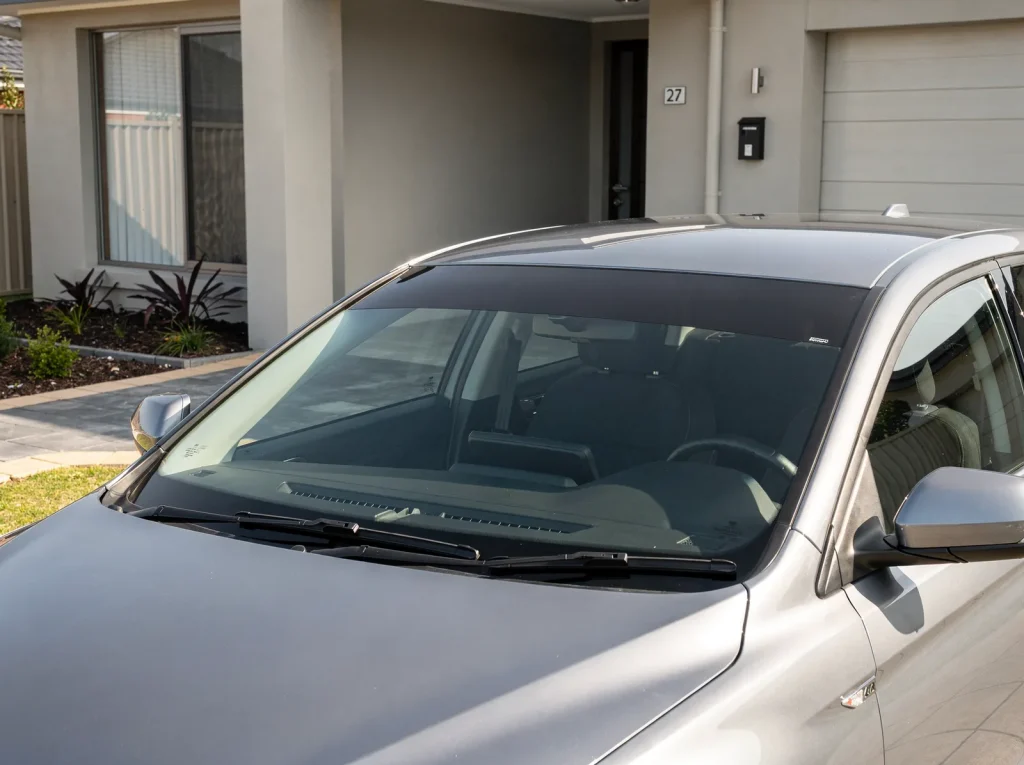 Tinted sun strip band across the top of a car windscreen in Perth.